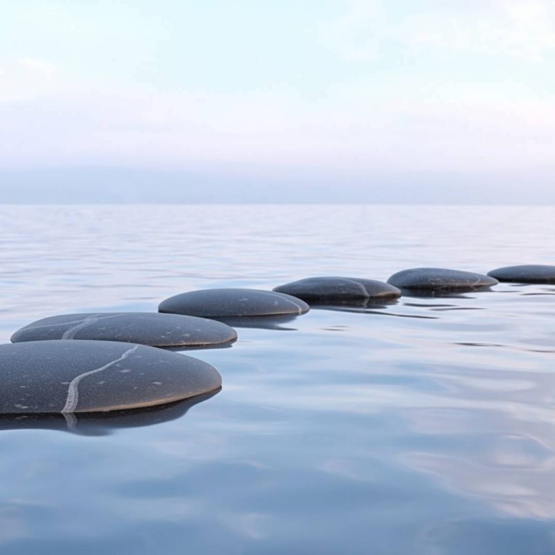 Zen Stones Sitting in Still Water