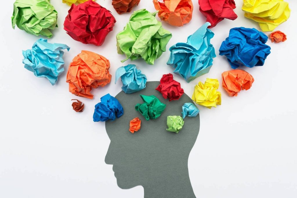 Head with Scrunched Up Colourful Pieces of Paper