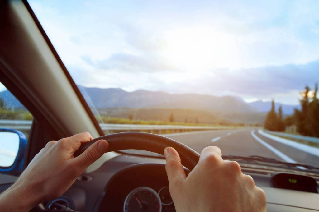 Man Behind Steering Wheel