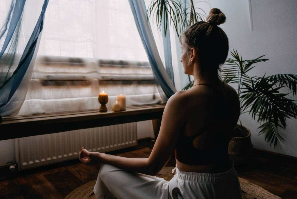 Woman Meditating at Home