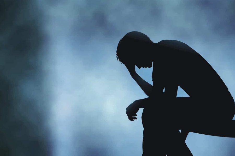 Man Looking Sad and Lonely with Sombre Background