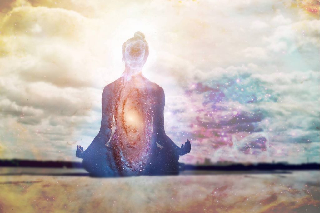 Woman Meditating in the Universe