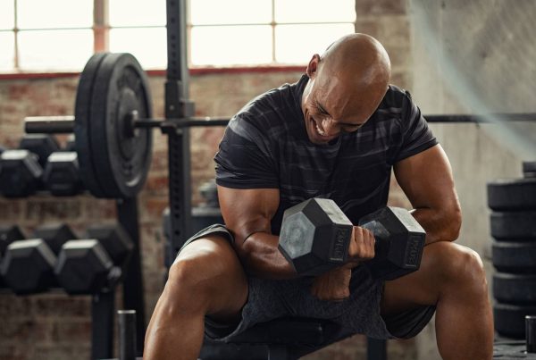 Black Man Working Out Lifting Dumbbell Strong