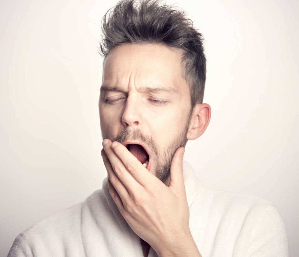 Man Looking Tired and Yawning