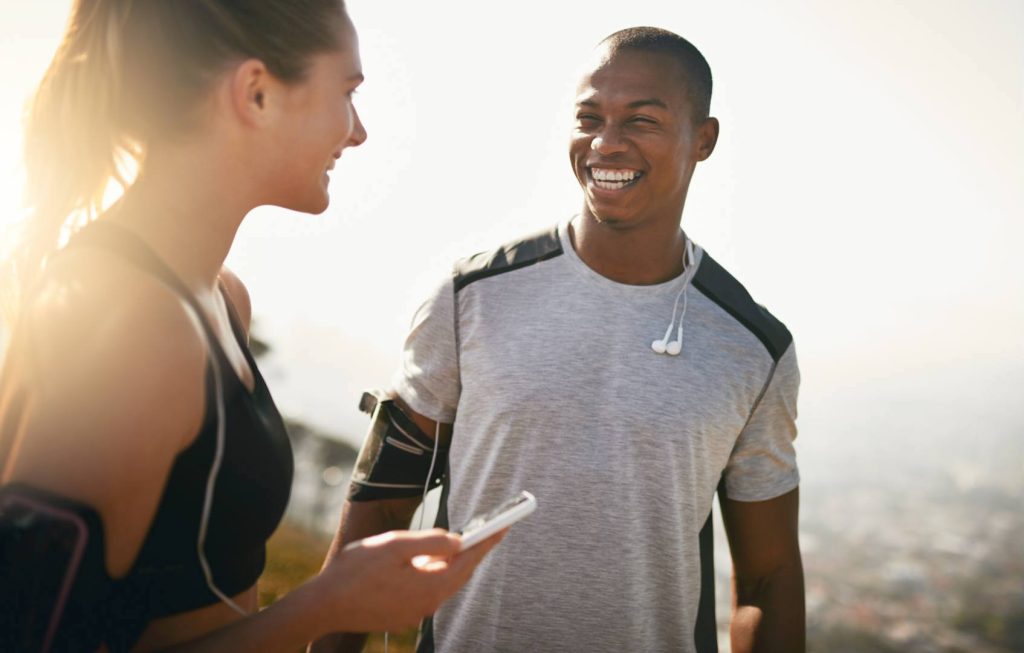 Two People Working Out Together Smiling