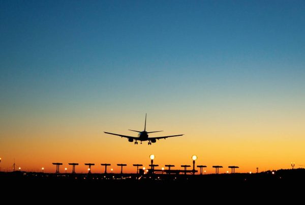 Plane Landing Safely at Airport During Sunset