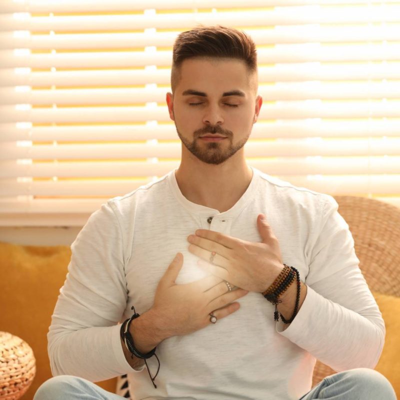 Man Holding Powerful Heart Being Self-Compassionate