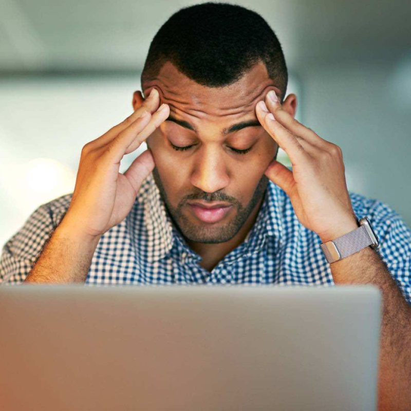 Man Stressed with Hands on Head Headache