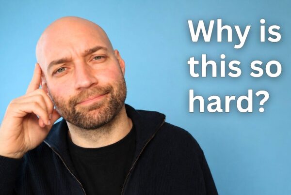 Thoughtful man with hand on head next to text ‘Why is this so hard?